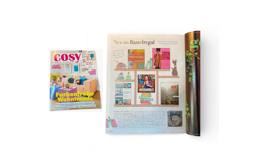 COSY Magazin mit bunter Wohntrend-Titelseite und DIY-Buchvorstellung im Magazin-Layout.