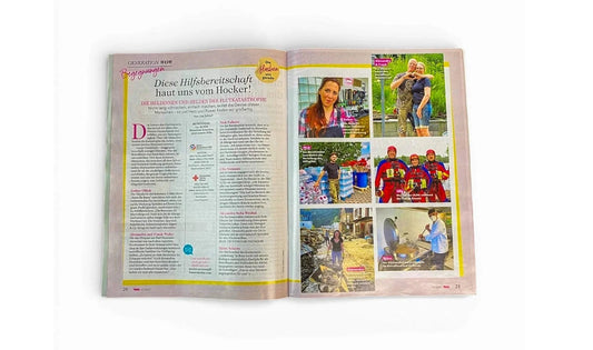 Aufgeschlagenes Magazin mit Bericht über Hilfsbereitschaft, Fotos von Helfern, Werkstatt für Schönes.